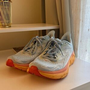 Hoka Light Blue and Orange Athletic Shoes